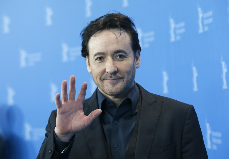 Actor John Cusack poses during a photocall to promote the movie 'Chi-Raq' at the 66th Berlinale International Film Festival in Berlin, Germany February 16, 2016.      REUTERS/Fabrizio Bensch