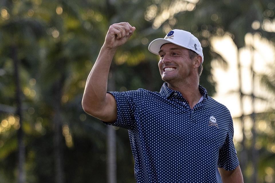 Captain Bryson DeChambeau, of Crushers GC, celebrates after making his putt on the 18th green during the finals of the LIV Golf Team Championship at the Trump National Doral golf club Sunday, Oct. 22, 2023, in Doral, Fla. (Doug DeFelice/LIV Golf via AP)