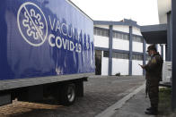 A soldier stands by a Health Ministry truck loaded with COVID-19 vaccines that El Salvador's government is donating and delivering to neighboring Honduras, before it departs San Salvador, El Salvador, Thursday, May 13, 2021. (AP Photo/Salvador Melendez)