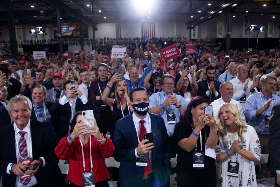 People cheer as Trump arrives for an indoor campaign rally at Xtreme Manufacturing in Henderson, a suburb of Las Vegas, Nevada.