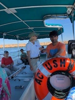 Kathy Frey and Mowladad Safeway on a boat ride on Buzzards Bay.