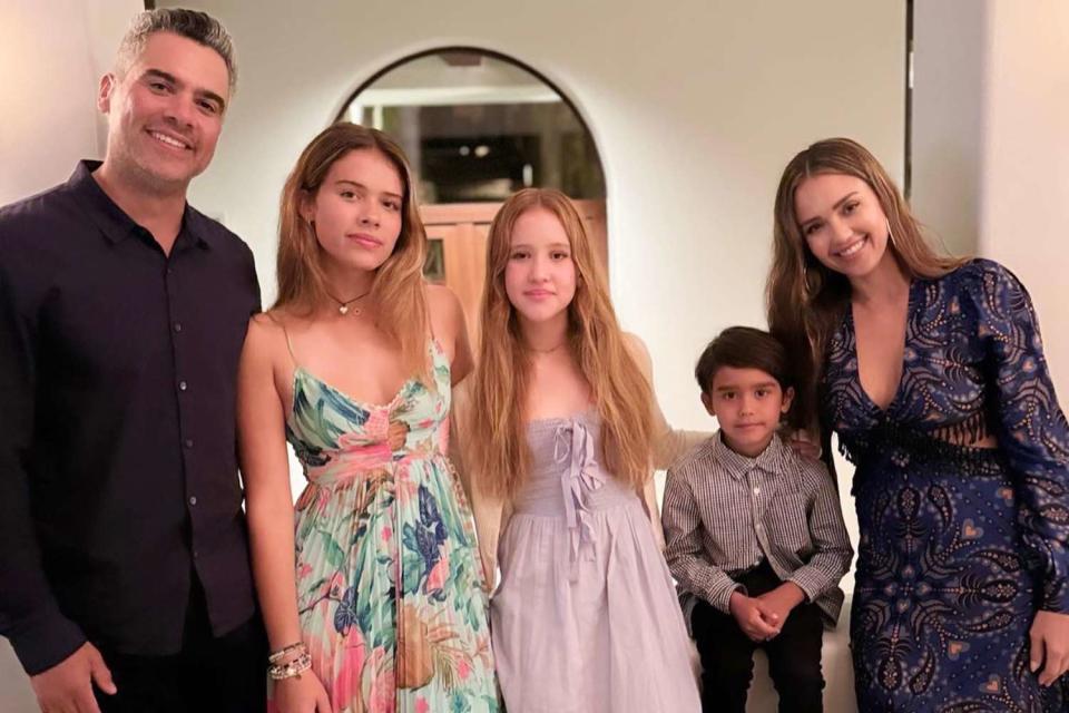 <p>Jessica Alba/ Instagram</p> Jessica Alba and her husband Cash Warren pose for a family photo with their 3 kids