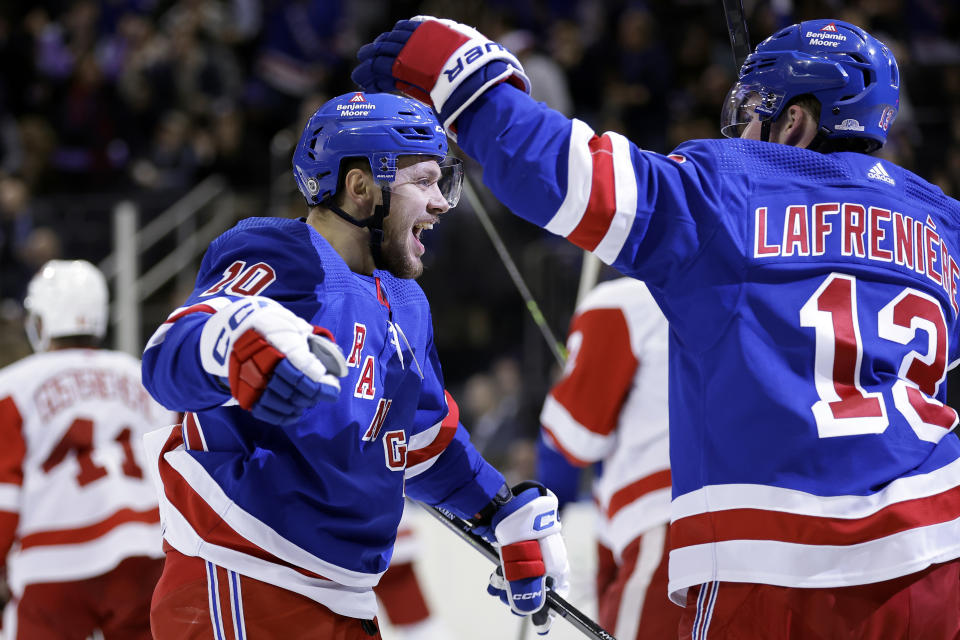 New York Rangers left wing Artemi Panarin (10) celebrates scoring a goal with Alexis Lafreniere (13) against the Detroit Red Wings in the second period of an NHL hockey game Tuesday, Nov. 7, 2023, in New York. The Rangers won 5-3. (AP Photo/Adam Hunger)