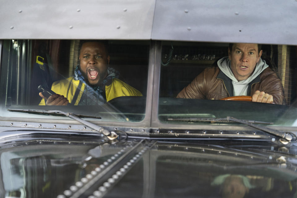 This image released by Netflix shows Mark Wahlberg, right, and Winston Duke in a scene from "Spenser Confidential." (Daniel McFadden/Netflix via AP)