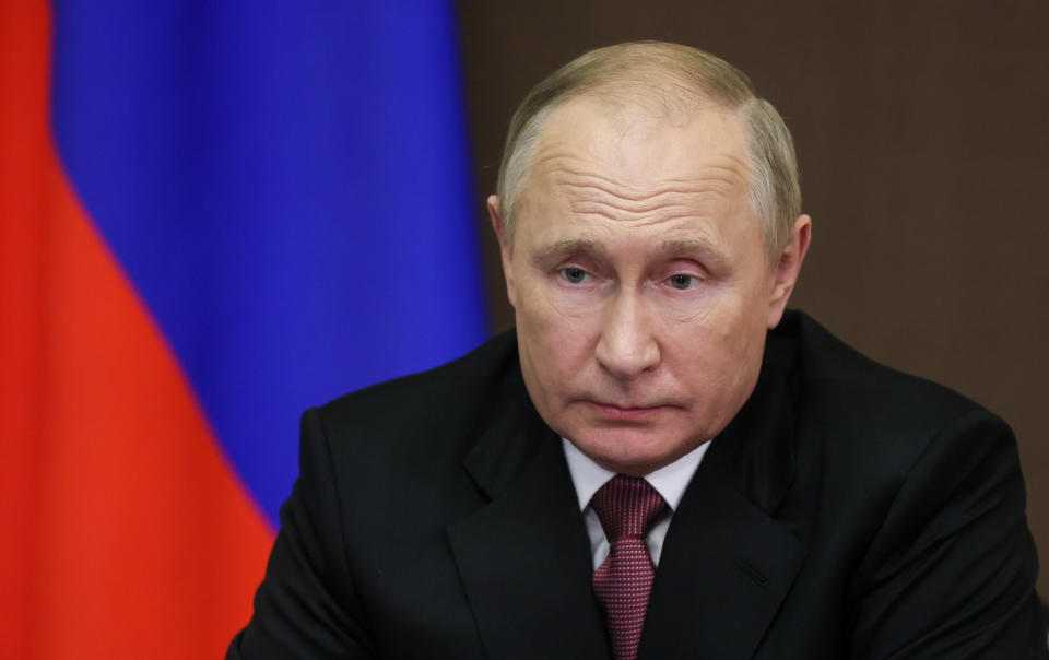 Russian President Vladimir Putin, wearing a suit and tie, at a videoconference meeting of the Russian Security Council.