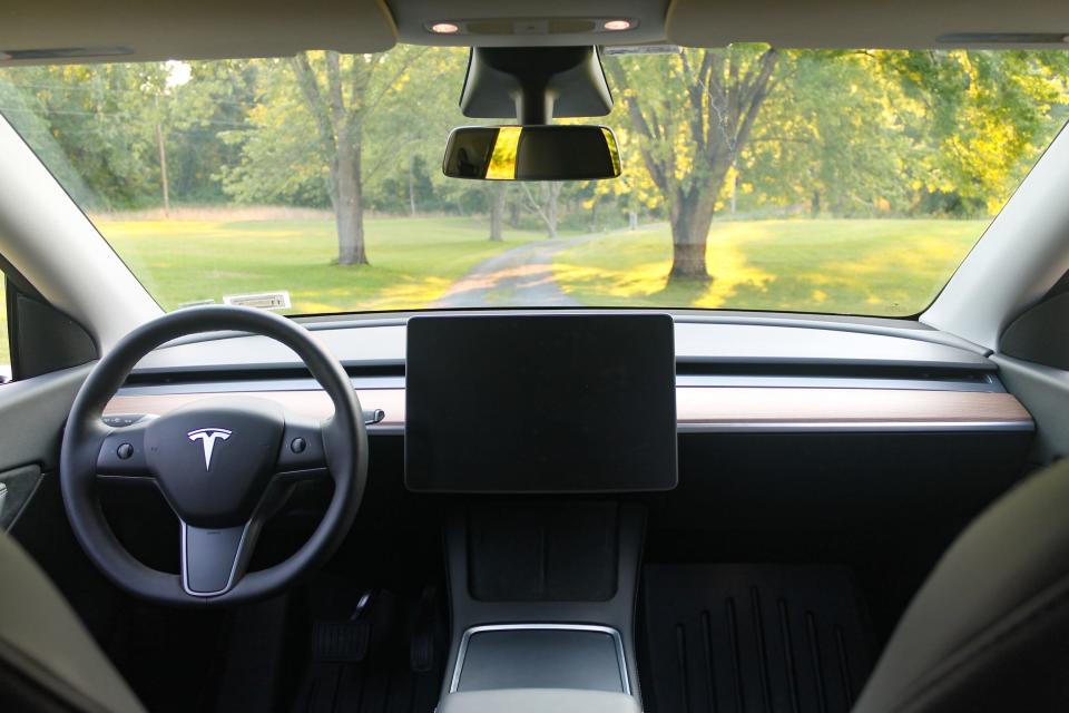 Front windshield and dashboard area of a Tesla Model Y.