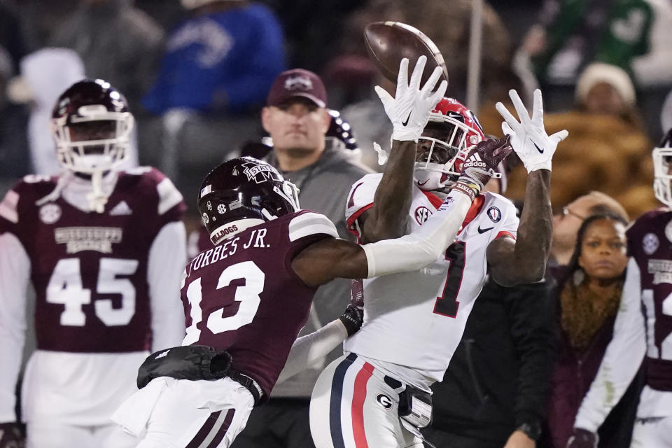 Mississippi State cornerback Emmanuel Forbes Jr. (13) breaks up a pass to Georgia wide receiver Marcus Rosemy-Jacksaint (1) during the second half of an NCAA college football game in Starkville, Miss., Saturday, Nov. 12, 2022. (AP Photo/Rogelio V. Solis)