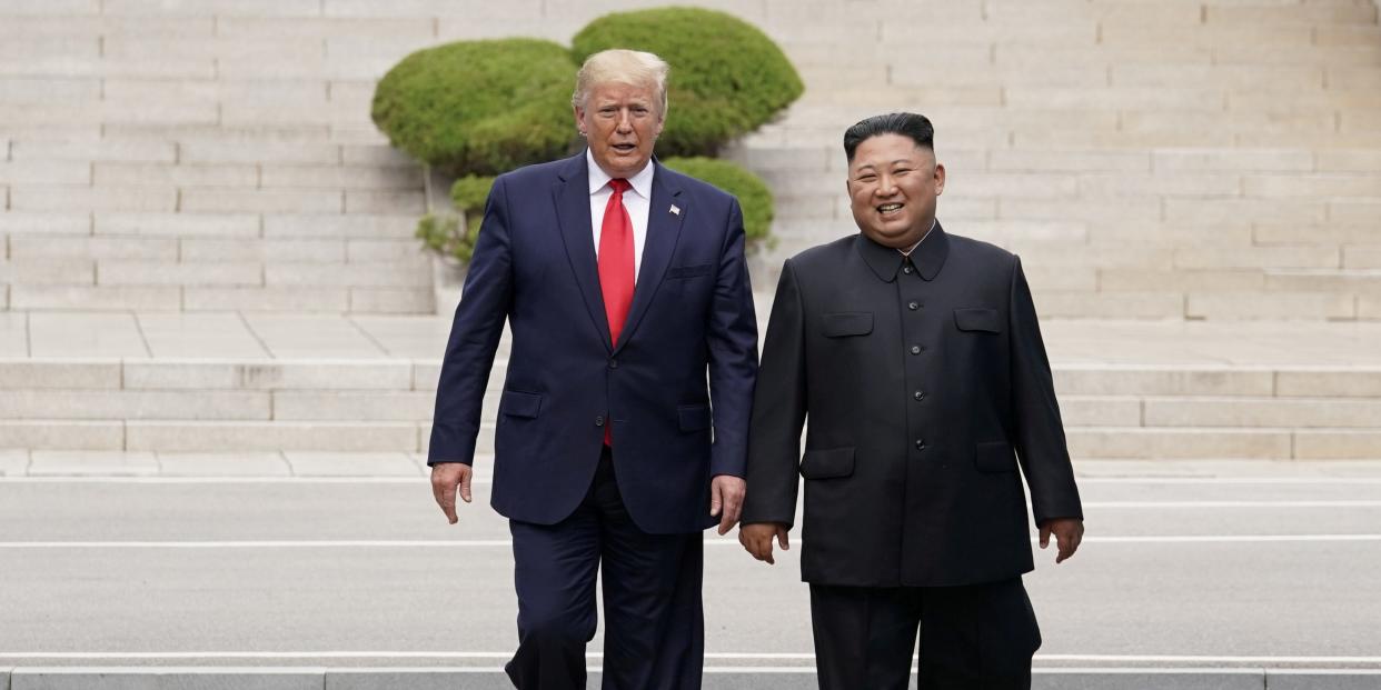 FILE PHOTO: U.S. President Donald Trump meets with North Korean leader Kim Jong Un at the demilitarized zone separating the two Koreas, in Panmunjom, South Korea, June 30, 2019. REUTERS/Kevin Lamarque