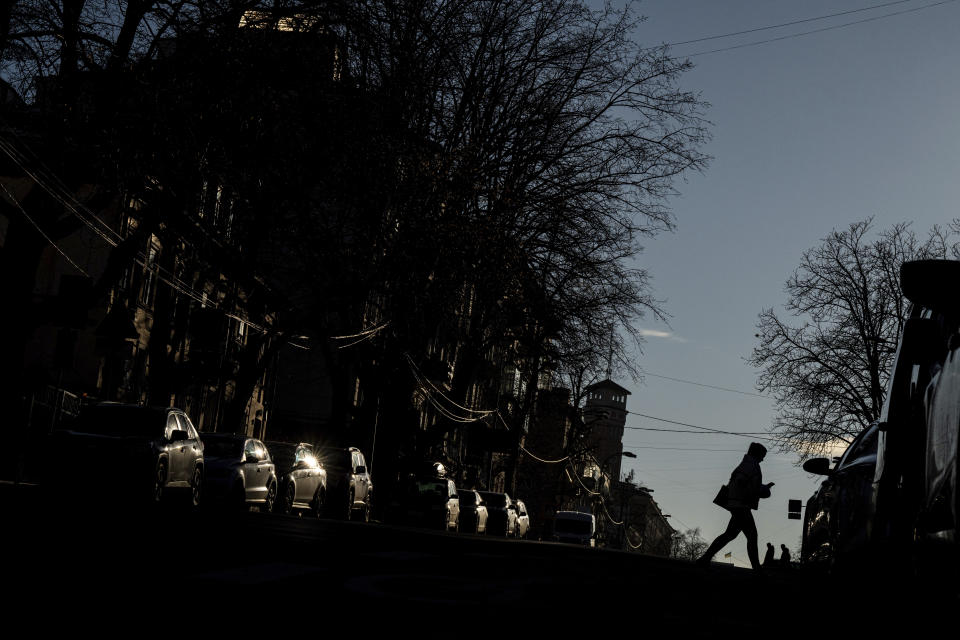 A woman walks on a street in downtown Kyiv, Ukraine, Wednesday, Dec. 20, 2023. (AP Photo/Evgeniy Maloletka)