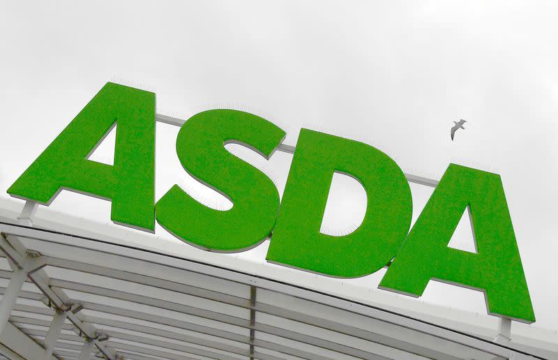 FILE PHOTO: A gull flies near an Asda store in west London, Britain