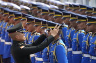 A Thai soldier checks royal guards before a welcome ceremony for New Zealand's Prime Minister Christopher Luxon in Bangkok, Thailand, Wednesday, April 17, 2024. (AP Photo/Sakchai Lalit)