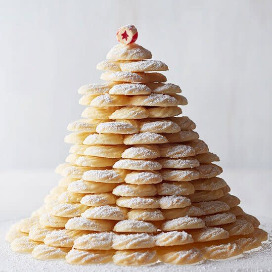 These rich and crisp coconut cookies look stunning stacked into a Christmas tree shape and dusted with powdered sugar!