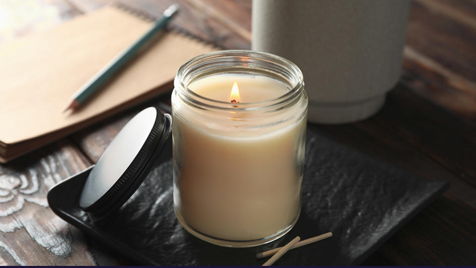 Candle in a glass jar which needs to be removed