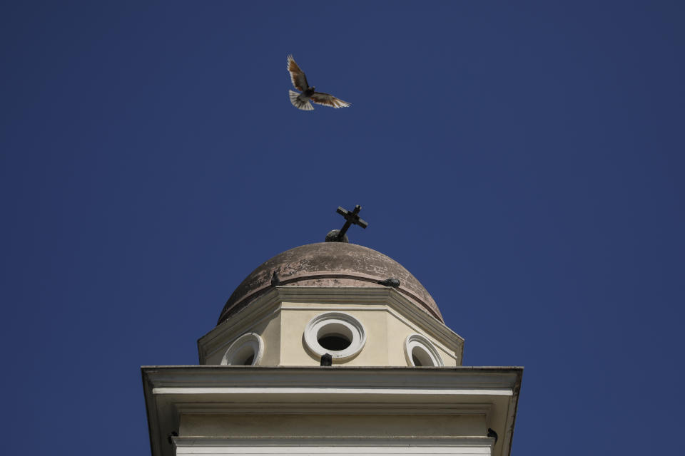 A pigeon flies next the damaged bell tower of Pantanassa church at the Monastiraki square following an earthquake in Athens, Friday, July 19, 2019. The Athens Institute of Geodynamics gave the earthquake a preliminary magnitude of 5.1 but the U.S. Geological Survey gave it a preliminary magnitude of 5.3. The Athens Institute says the quake struck at 2:38 p.m. local time (1113 GMT) about 26 kilometers (13.7 miles) north of Athens. (AP Photo/Petros Giannakouris)