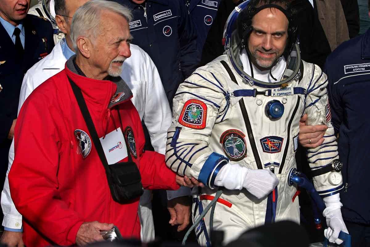 Space tourist Richard Garriott walks with his father US astronaut Owen Garriott before boarding the spacecraft at the Baikonur cosmodrome, in Kazakhstan, on October 12, 2008.