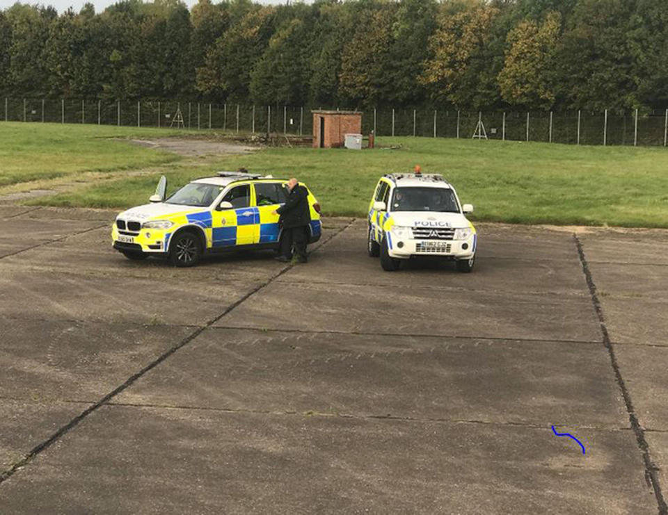 Police officers by the Ryanair plane at Stansted airport (@zulu_wooloo/PA Wire)
