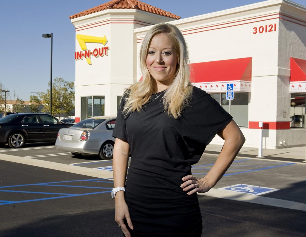 In-N-Out’s billionaire heiress says she stood in line for 2 hours to land a job at her own store when she was just a teenager to shake the ‘stigma of being the owner’s kid’ and ‘earn respect’