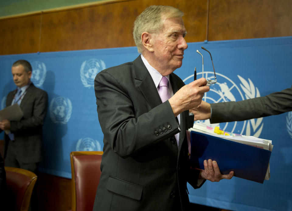 Retired Australian judge Michael Kirby, center, chairperson of the commission of Inquiry on Human Rights in the Democratic People's Republic of Korea, takes off his glasses after delivering the commission's report during a press conference at the United Nations in Geneva, Switzerland, Monday, Feb. 17, 2014. A U.N. panel has warned North Korean leader Kim Jong Un that he may be held accountable for orchestrating widespread crimes against civilians in the secretive Asian nation. Kirby told the leader in a letter accompanying a yearlong investigative report on North Korea that international prosecution is needed "to render accountable all those, including possibly yourself, who may be responsible for crimes against humanity." (AP Photo/Anja Niedringhaus)