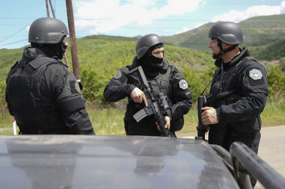 Kosovo police special unit members secure the area near the village of Cabra, north western Kosovo, during an ongoing police operation on Tuesday, May 28, 2019. A Kosovo police operation against organized crime in the north, where most of the ethnic Serb minority lives, has sparked tension, and Serbia ordered its troops to full alert. (AP Photo/Visar Kryeziu)