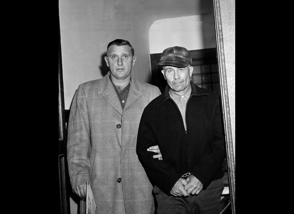 Edward Gein, 51, of Plainfield, Wisc. enters Central State Hospital for the Criminally Insane Nov. 23,1957, in Milwaukee. Gein admitted to slaying two women and dismembering their bodies as well as robbing graves. Gein flayed the bodies and used human skin and other body parts to decorate furniture and clothing in his decrepit farmhouse. His twisted tale was the inspiration for murders in movies like Buffalo Bill from "The Silence of the Lambs." 