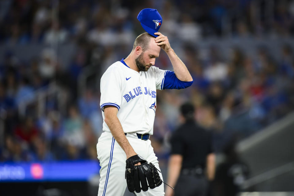 Toronto Blue Jays pitcher Tim Mayza walks back to the dugout after the top of the eighth inning of the team's baseball game against the Chicago White Sox on Tuesday, May 21, 2024, in Toronto. (Christopher Katsarov/The Canadian Press via AP)