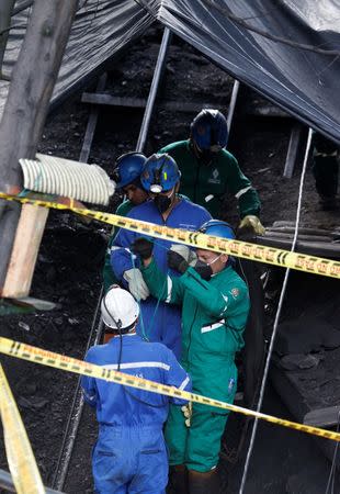 Rescue personnel enter a mine to search missing for miners after an explosion at an underground coal mine on Friday, in Cucunuba, Colombia June 24, 2017. REUTERS/Jaime Saldarriaga