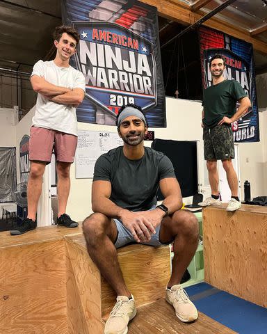 <p>Courtesy of Chinna Balachandran and Erica Wendel</p> Chinna Balachandran, center, on the set of American Ninja Warrior