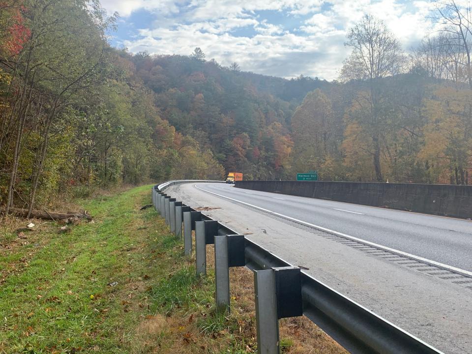A dead black bear can be seen to the left of the guard rail on Interstate 40 Nov. 2, two miles from Harmon Den, where the state Department of Transportation is planning a wildlife passage to aid bear, deer and elk to move from one side of the interstate to the other.