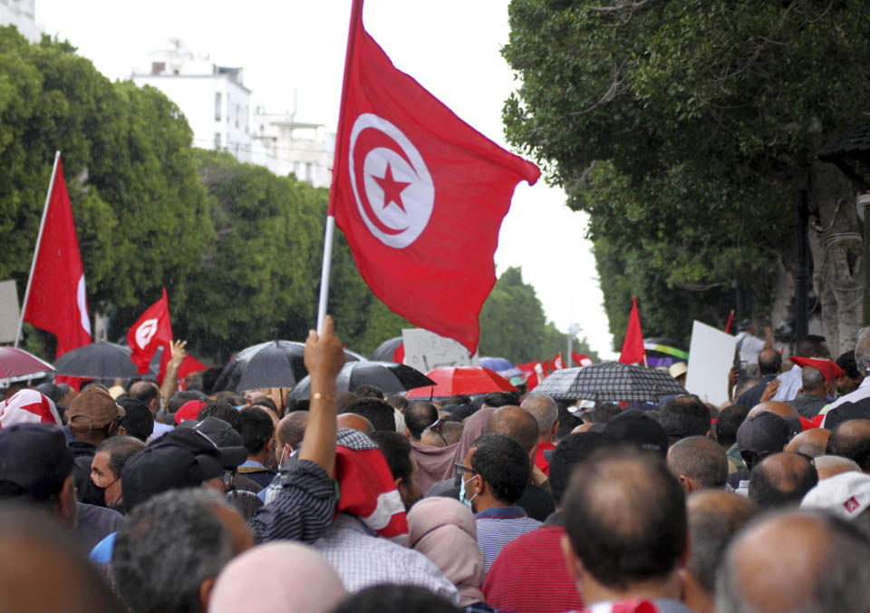 Tunisians demonstrate against Tunisian President Kais Saied in Tunis, Tunisia. Sunday, Oct. 10, 2021. Thousands of people demonstrated in Tunisia’s capital Sunday against the president’s seizure of powers in July and other moves seen as threatening the country’s democratic gains since the Arab Spring. (AP Photo/Hassene Dridi)