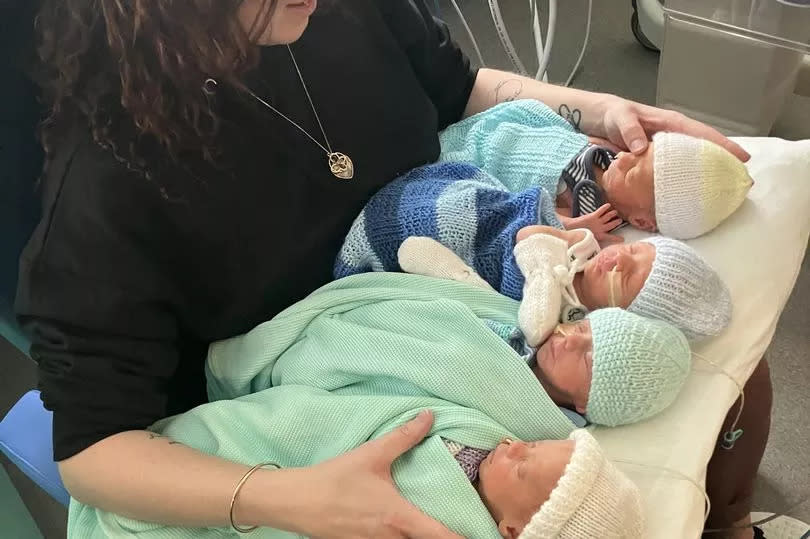 A couple are celebrating after beating massive odds of one in 700,000 to give birth to four baby boys