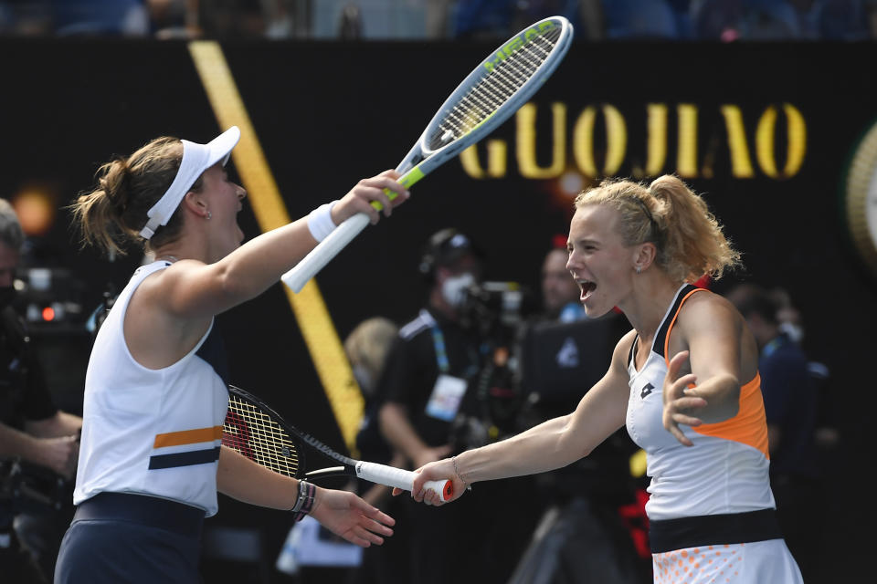 Barbora Krejcikova, left, and Katerina Siniakova of the Czech Republic embrace as they celebrate their win over Anna Danilina of Kazakhstan and Beatriz Haddad Maia of Brazil in the women's doubles final at the Australian Open tennis championships in Sunday, Jan. 30, 2022, in Melbourne, Australia.(AP Photo/Andy Brownbill)