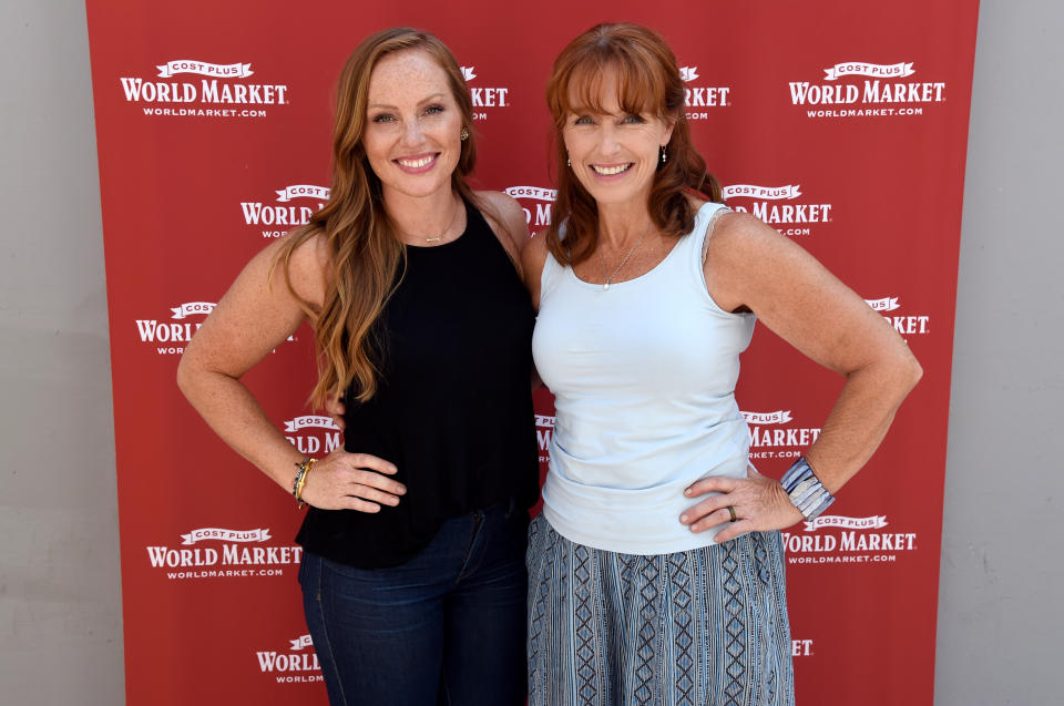 Mina Starsiak Hawk and mom Karen E. Laine stand with hands on their hips