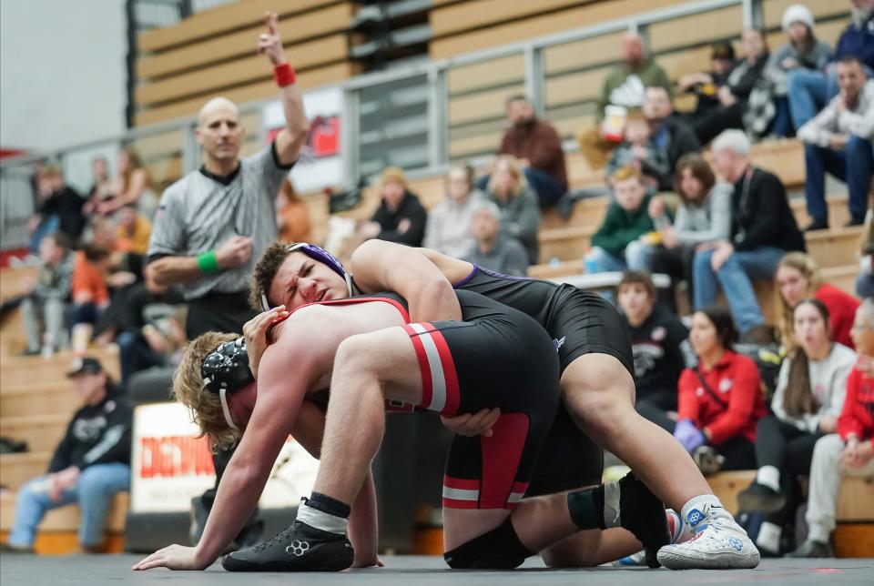 Bloomington South’s Mason Grubb (top) wrestles against Edgewood’s Benson Long in the 190-pound match during their dual meet at Edgewood on Thursday, Jan. 18, 2024.