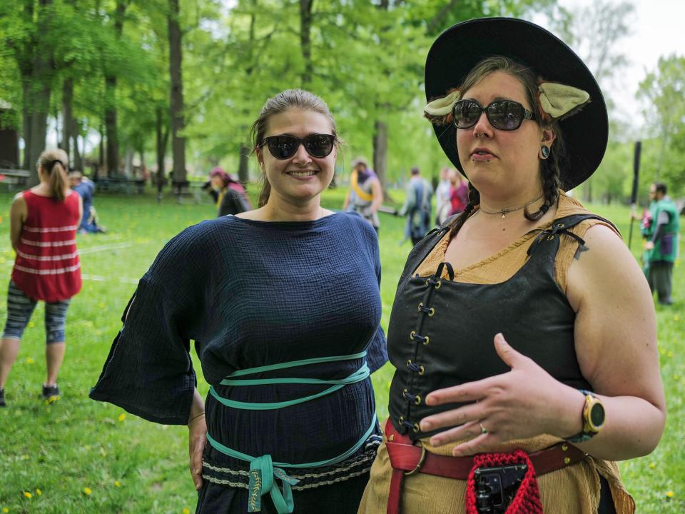 Lauren Warshaw, or Lady Alpaca, left, and Erika Daggett whose persona is Lady Ailis, show the costumes they wear Sundays at Patriarche Park during the Amtgard fantasy games Sunday, May 15, 2022.
