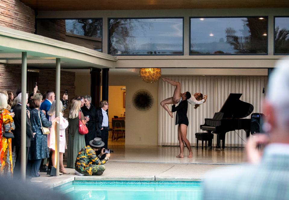 Dancers Chad Ortiz and Heidi Buehler give a performance in honor of Gene Kelly at Frank Sinatra's Twin Palms estate in Palm Springs, Calif., Saturday, Feb. 26, 2022.