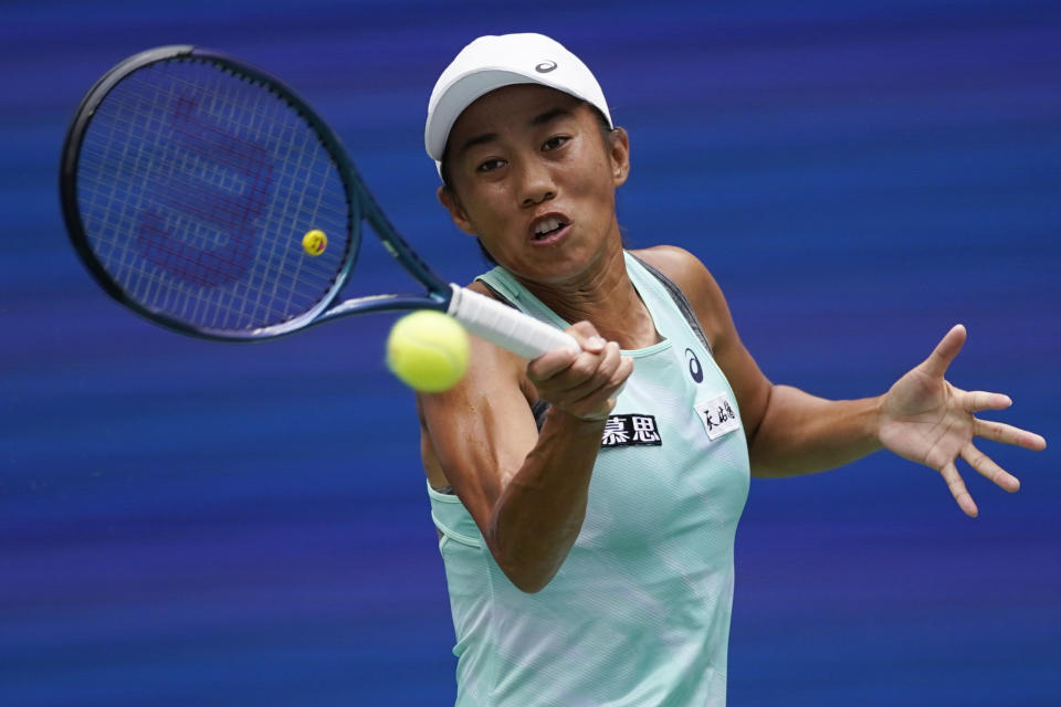 Shuai Zhang, of China, returns to Coco Gauff, of the United States, during the fourth round of the U.S. Open tennis championships, Sunday, Sept. 4, 2022, in New York. (AP Photo/Eduardo Munoz Alvarez)