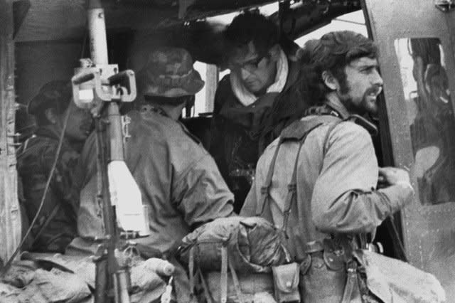 On February 10, 1971, news photographers (l-r) Keisaburo Shimamoto, Newsweek Henri Huet, AP Larry Burrows LIFE Magazine and Kent Potter, UPI, board a Vietnamese Huey helicopter in Lang Vei on the Vietnam-Laos border to cover Lam Son 719, a South Vietnamese invasion of Laos intended to cut the Ho Chi Minh trail. The chopper was shot down a few minutes later and exploded. It was the worst single loss of news media members during the Vietnam War. File Photo by Sergio Ortiz
