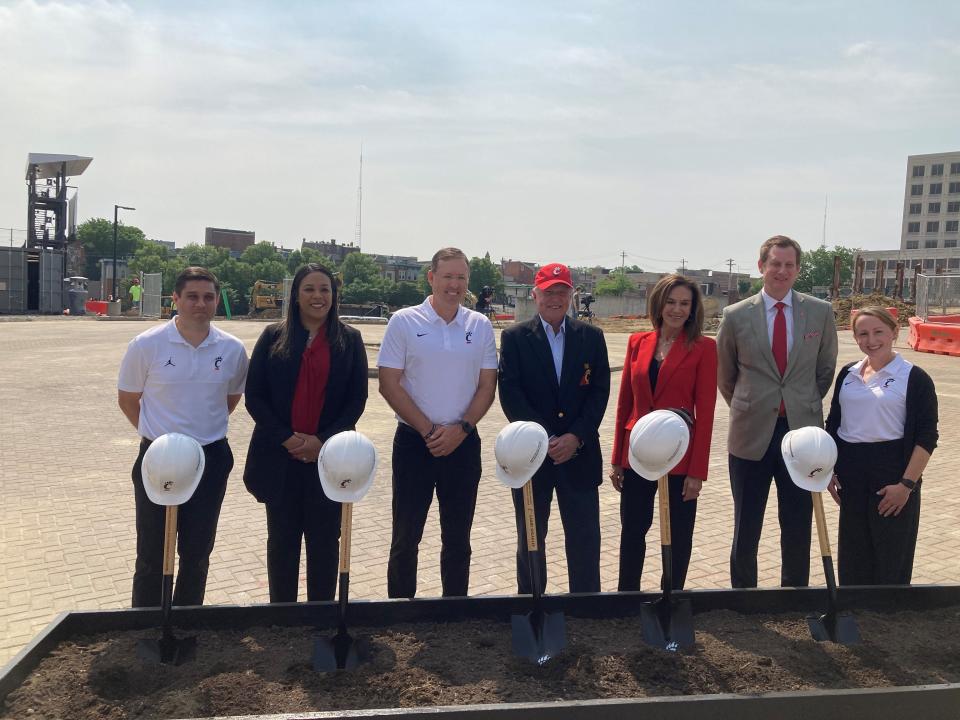 UC coaches attended Tuesday's ground breaking of the new indoor practice facility. From left are men's basketball coach Wes Miller, women's basketball coach Katrina Merriweather, football coach Scott Satterfield, major donors Larry and Rhonda Sheakley, UC athletic director John Cunningham and volleyball coach Molly Alvey.