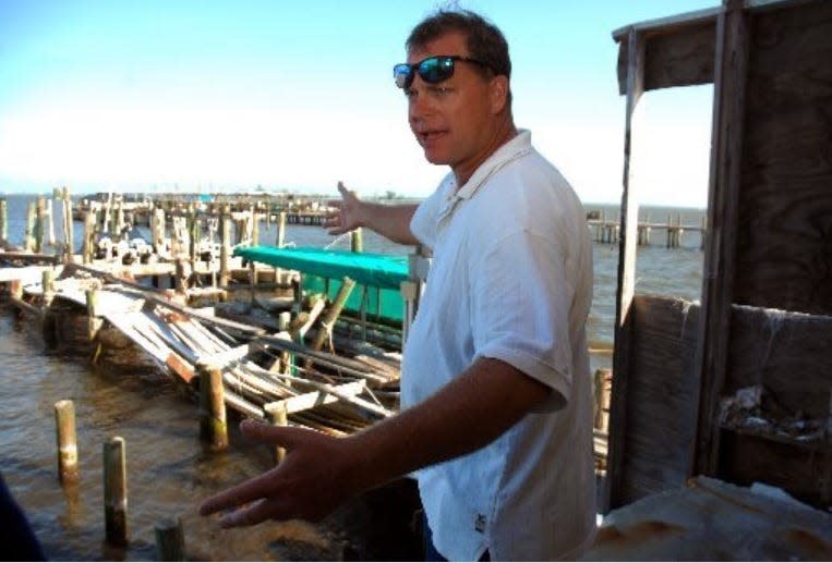 On Nov. 18, 2008, Charles Sembler shows a visitor the fish house and docks on the Sebastian riverfront he'd like to see preserved as a non-profit commercial fishing and educational center. The docks and the structure were damaged in the 2004 hurricanes.