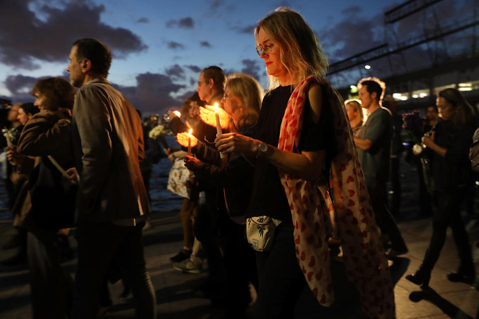 <p>People converge with candles for a vigil to walk along a bike path in Lower Manhattan on Nov. 2, 2017 in New York City. (Photo: Spencer Platt/Getty Images) </p>