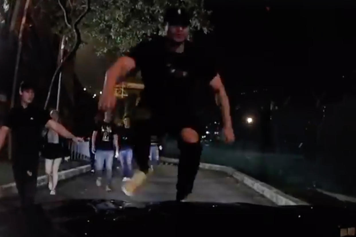 A screengrab from the video showing Chee Chu Siong, 26, jumping onto the bonnet of the Grab driver’s car. (PHOTO: Facebook / Belleiansa Xu)