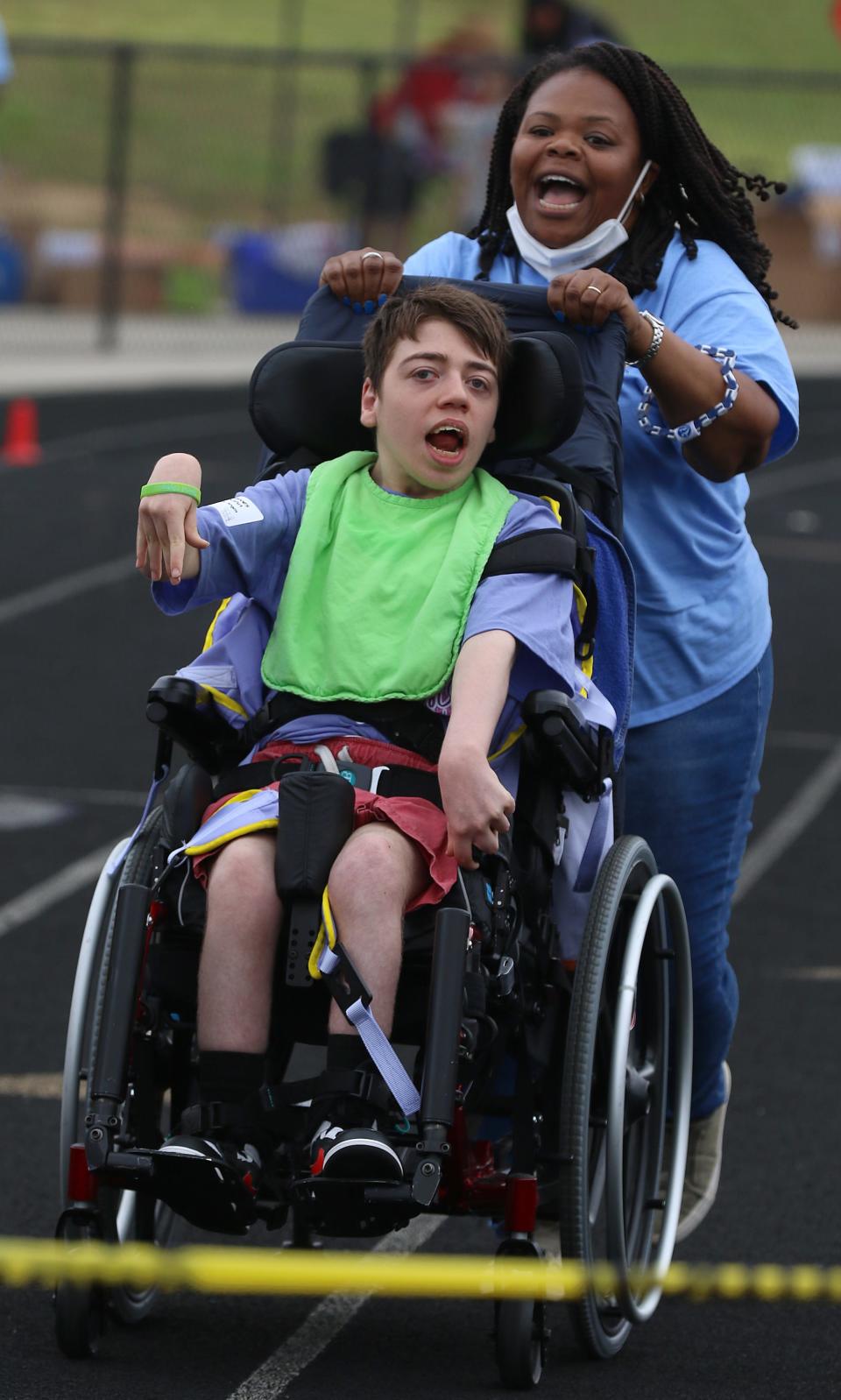 Cassandra Houston and James Dunn race to the finish during the Gaston County Special Olympics Spring Games held Friday morning, May 6, 2022, at Stuart Cramer High School.