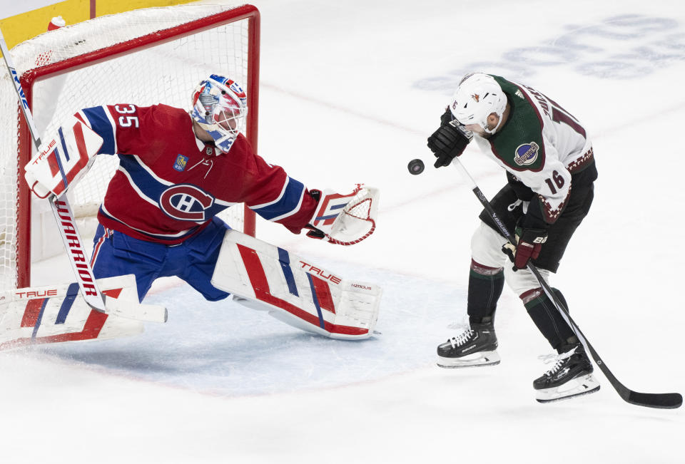 Montreal Canadiens goaltender Sam Montembeault (35) stops a shot by Arizona Coyotes' Jason Zucker (16) during the second period of an NHL hockey game Tuesday, Feb. 27, 2024, in Montreal. (Christinne Muschi/The Canadian Press via AP)