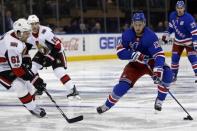 Nov 19, 2017; New York, NY, USA; New York Rangers center Kevin Hayes (13) controls the puck past Ottawa Senators right wing Mark Stone (61) during the second period at Madison Square Garden. Adam Hunger-USA TODAY Sports