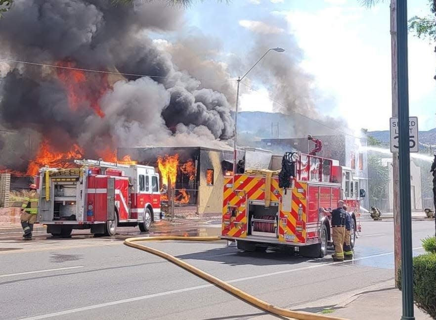 Firetrucks can be seen at the scene of a fire on Aug. 23, 2023, in the 600 block of Live Oak Street in Miami, Ariz.