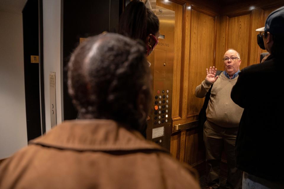 Millennia interim executive director Arthur Krauer avoids answering questions from tenants as he tries to take the elevator following the November meeting.