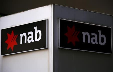 A National Australia Bank (NAB) sign is displayed outside an office building in central Sydney, Australia, July 24, 2015. REUTERS/David Gray