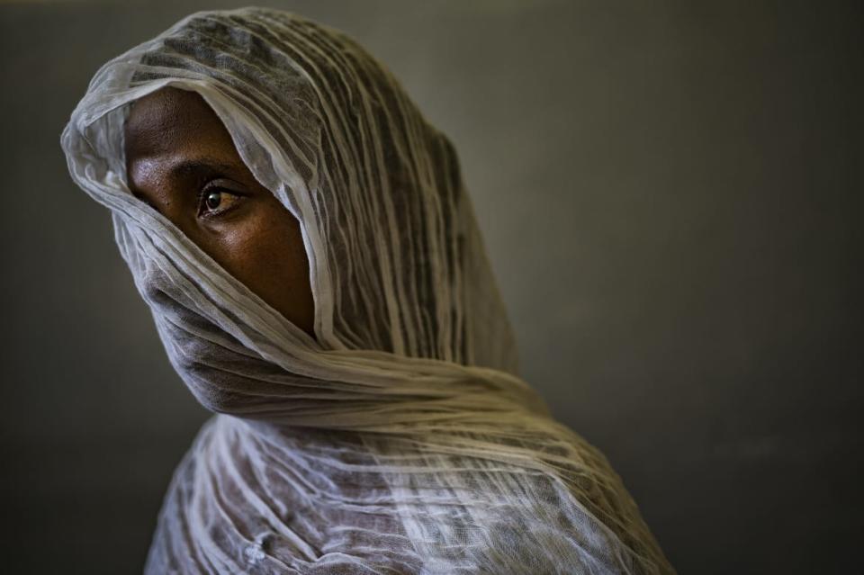 <div class="inline-image__caption"><p>Eyerus, 40, poses for a portrait in a safe space for victims of sexual assault in the Ayder Hospital in Mekele, Tigray, Ethiopia, May 2021.</p></div> <div class="inline-image__credit">Lynsey Addario</div>