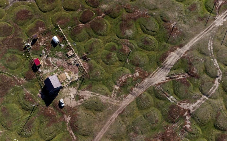 A house located on land that has been deformed by permafrost thaw (Reuters)