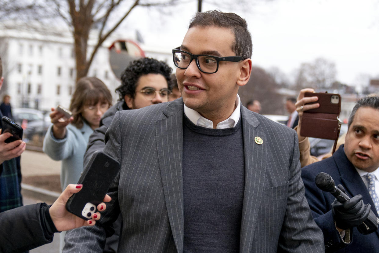 FILE — Rep. George Santos, R-N.Y., leaves a House GOP conference meeting on Capitol Hill, in Washington, Jan. 25, 2023. Santos is carrying on in Congress despite calls for him to resign. Santos admitted to fabricating many aspects of his life story, but the newly elected congressman is refusing calls to quit. (AP Photo/Andrew Harnik, File)